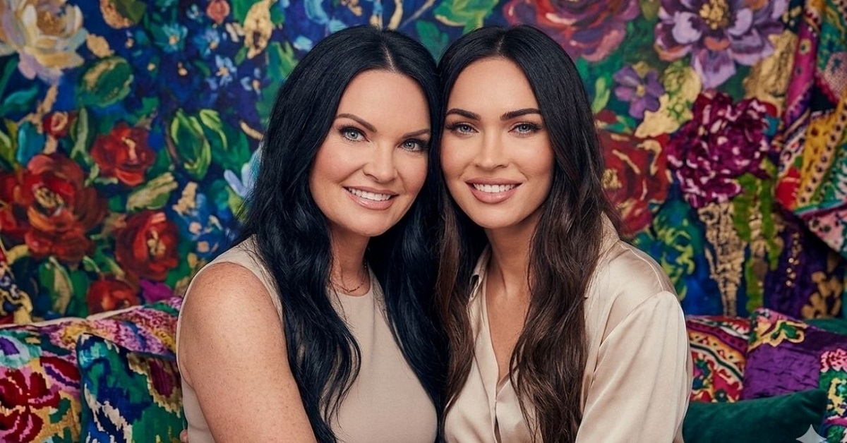 Kristi Branim Fox and her younger sister Megan Fox smiling together, posed in front of a colorful floral background